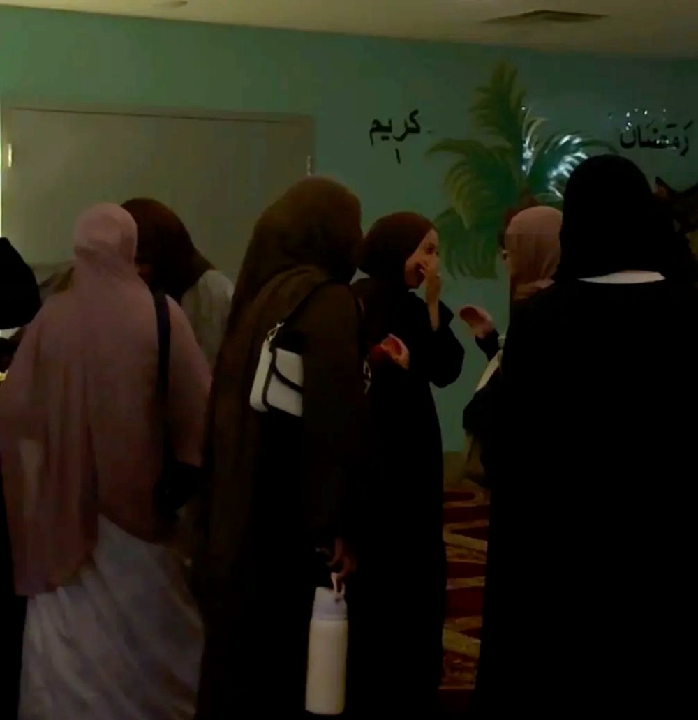 Attendees talking together at the end of an evening.
